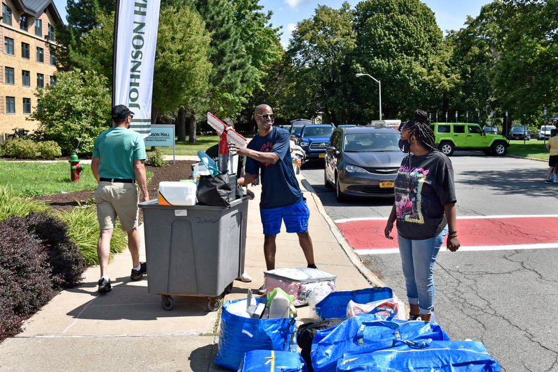 Jasmyne Daley, a freshman psychology major, moves her belongings into Johnson Hall on Aug. 18 with help from her uncle, David Gore.