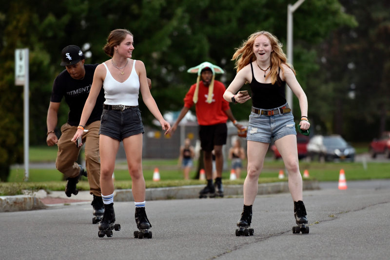 Faith Coyle (left) and Ellen Decker enjoy some advanced roller skating around the parking lot during the Laker Launch Pre-Torchlight Party.