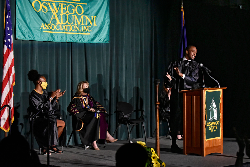 Kamal Morales (at the podium) delivered the student address at Welcoming Torchlight on Friday, Aug. 20. 