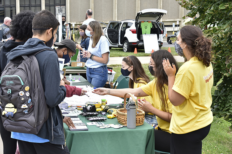 Counseling Outreach Peer Educators (COPE) offer information about mental health and counseling programs and services during the health and wellness fair held Sept. 1 outside Marano Campus Center. The student peer educators, from left, Erin Wilmot, Jill Daniele and Adriana Militello work with the college’s Counseling Services Center.