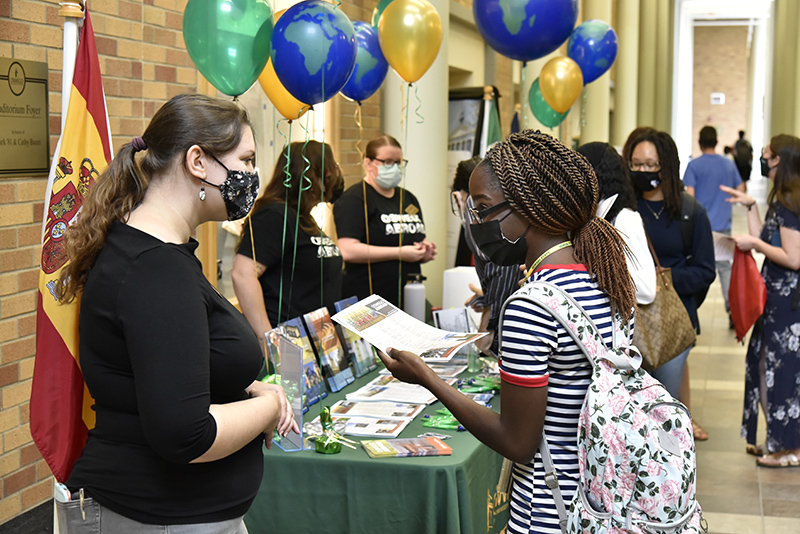 Allison McGinley (left), an Education Abroad secretary for the Office of International Education and Programs, talks with Anrycha Mackey, a senior accounting major and international student from the Bahamas, during the Study Abroad Fair held Sept. 1 in the Marano Campus Center concourse.