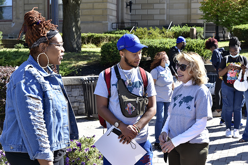 College President Deborah F. Stanley (right) speaks Sept. 26 with poet Jillian Hanesworth and Marquél Jeffries of the college's Institute for Equity, Diversity, Inclusion and Transformative Practices and member of the ALANA Planning Committee, at Oswego City Hall before the ALANA Peace Walk. Hanesworth provided spoken word poetry at the ceremonial beginning of the walk and later during its conclusion at Marano Campus Center.