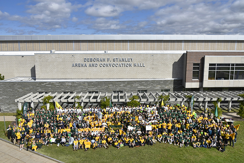 Lakers and guests adorned in Oswego colors took part in a very special 2021 Green and Gold Day photo on Friday, Oct. 1, in front of the newly named Deborah F. Stanley Arena and Convocation Hall.