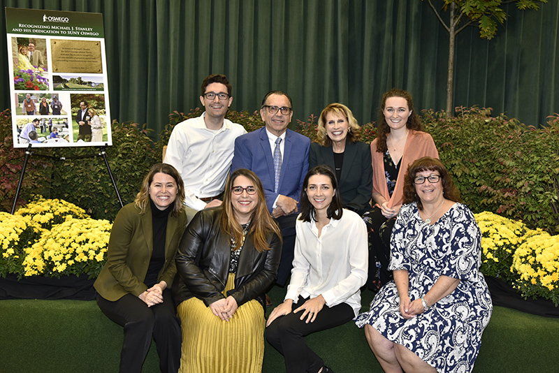 Pictured at the bench, which features an engraved plaque in Michael Stanley’s honor, are Deborah and Michael Stanley with immediate family members.