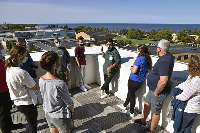 Student tour guide Danny Hernandez, a broadcasting and mass communication major, helps a group enjoy the view from the Shineman Center's Innovation Wing Observation Deck during one of the well attended Fall Open House tours.