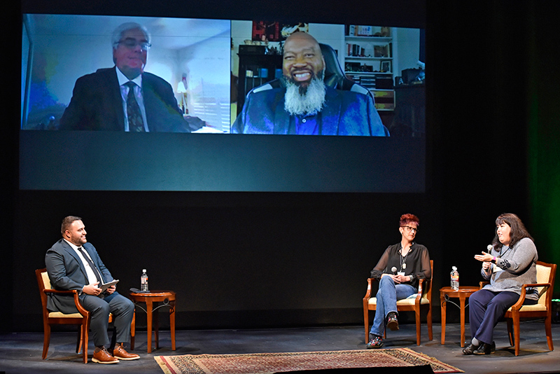 Panelists for the 2021 Lewis B. O'Donnell Media Summit discussing streaming media included  panelists (on stage) Jamie Duemo, Amazon Web Services; and Chrissy Guest, Ithaca College, with online panelists (on screen) 1983 alumnus Frank Palumbo, Nielsen, and Renard Jenkins, Warner Media. Moderator, at eft) was Justin Dobrow, a 2017 SUNY Oswego graduate, NBCUniversal supporting Peacock.