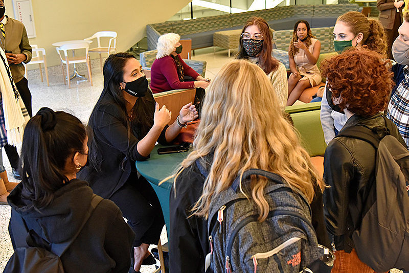  Shown with students in the Tyler Hall lobby after the panel discussion is 2017 graduate Carmen Mendoza, commercial operations coordinator for Sundance TV, during the Lewis B. O'Donnell Media Summit Career Connectors event