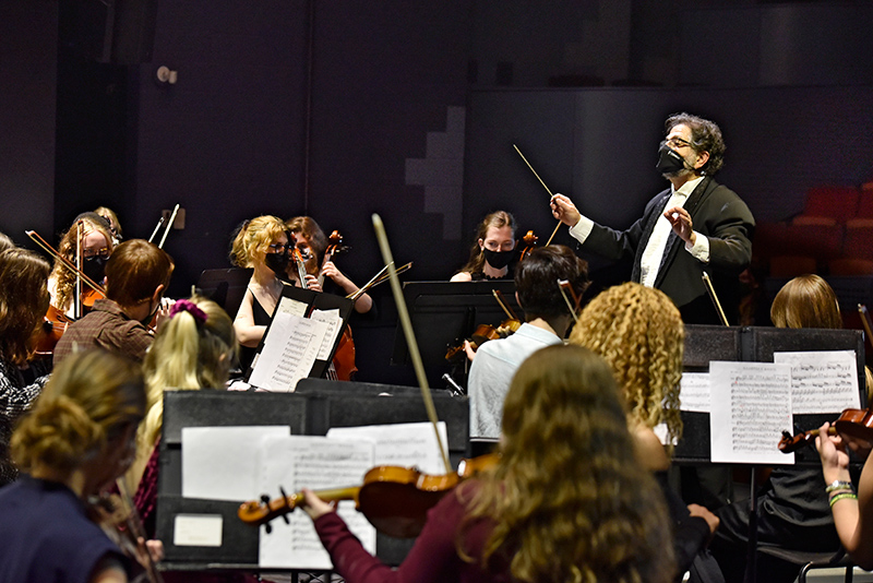 Music professor Juan LaManna directs the College-Community Orchestra in the group’s free concert Nov. 18 in Waterman Theatre. The annual performance showcases the musical talents of Oswego students and community members.