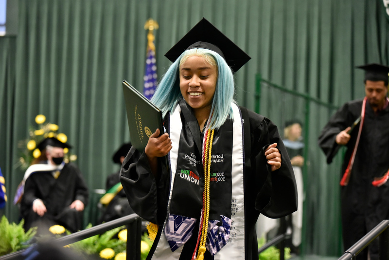 Shown during her class of 2021 graduation is Lorenne Huaman, who earned a bachelor's degree from the School of Communication, Media and the Arts, and served as Black Student Union vice president in 2020-21.
