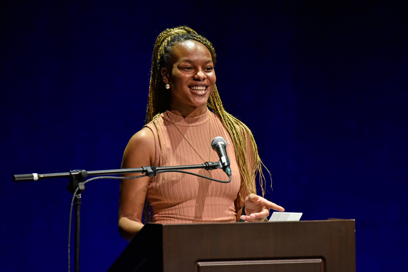 Student Association President Takayla Beckon gives welcome remarks to the Waterman Theater audience for the Martin Luther King Jr. Celebration.