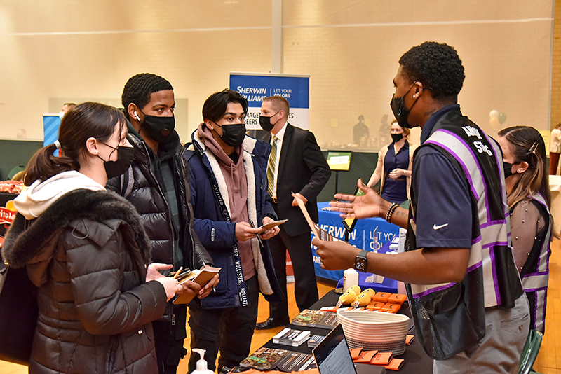  Pictured from left are Mia-Jolie Valle, a freshman early childhood education major; Axell Caceres, a freshman business administration major; and Oscar Rivera, a freshman wellness management major; talking with Amazon staffing coordinator Wayne Hatfield and Amazon staffing administrator Kathryn Short.