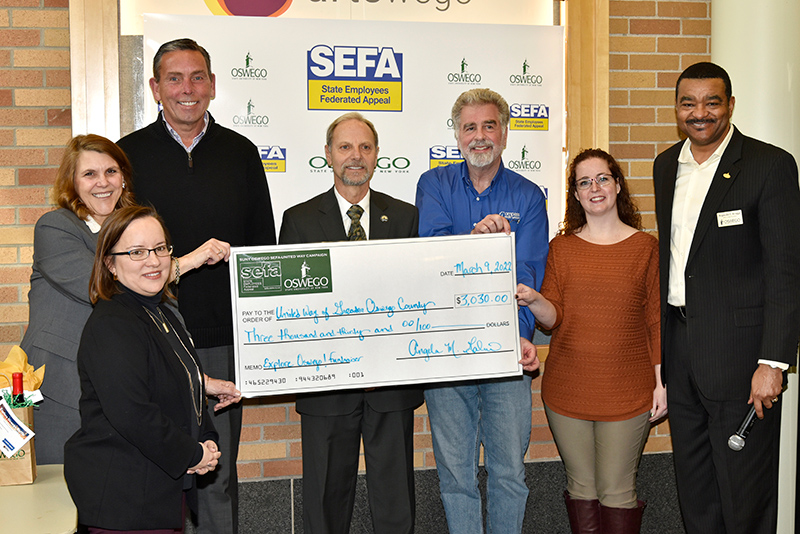 SUNY Oswego's State Employees Federated Appeal (SEFA) fundraising efforts presented $3,030 raised from the Explore Oswego campaign for the United Way of Greater Oswego County during a ceremony held March 9 in Marano Campus Center. College employees involved in the SEFA campaign and other boards reflect the campus-community partnerships that support local initiatives. 