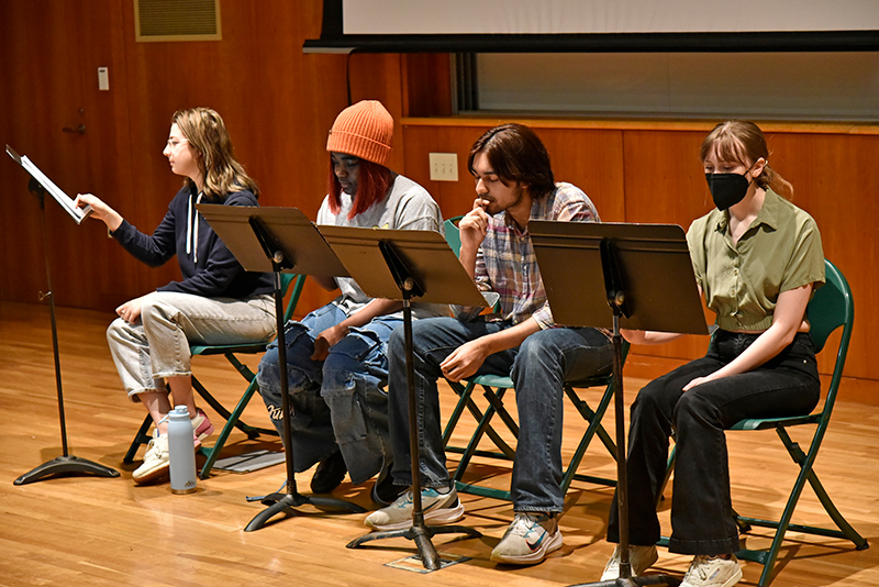 Theatrical reading of a play authored by student Anastasia West (not pictured), titled "Purpose and Intention (or: Three People with Four Chairs),” was among the attractions for Quest. Performing the reading in Marano Campus Center Auditorium are fellow theatre students, from left, Abby Hines, Shy Sims, Kuvar Bhatnagar and Natalie Griffin.