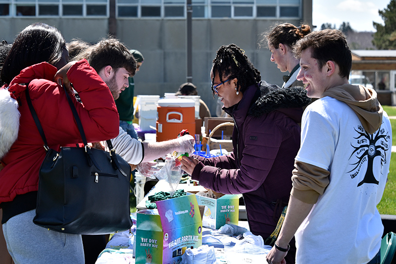 Student Association President Takayla Beckon and Chief of Staff Tristan Caruana offer some fun tie-dye shirt making at the Earth Day celebrations held April 22 in the quad between Marano Campus Center and Cooper Hall. 