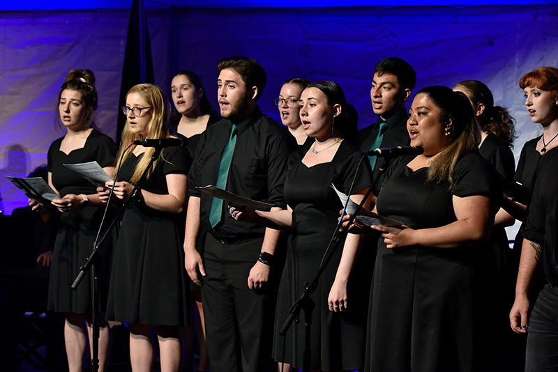 The Senior Sing performance ushers in the beginning of the Commencement Eve Torchlight Ceremony May 13.