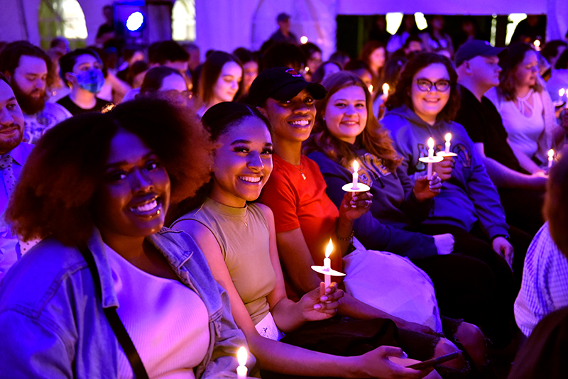 Amaya Corporan (second from left) sits among fellow graduating seniors at the annual Commencement Eve Torchlight ceremony held May 13. 