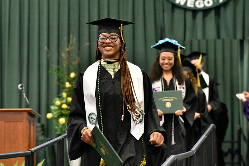Student Association President Takayla Beckon walks down the graduation ramp during a May 14 Commencement ceremony