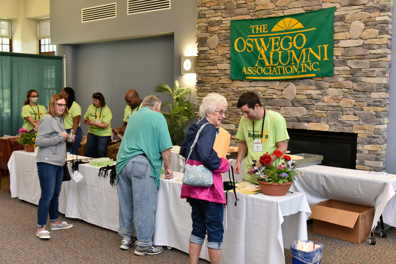 Alumni check into Reunion HQ in Riggs Hall, assisted by the more than 40 reunion planning and giving volunteers who helped make Reunion Weekend a memorable event.