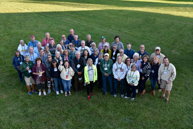 Longtime friends pose during the 45th Reunion group photo for the class of 1977 at the Welcome Back BBQ at Fallbrook.
