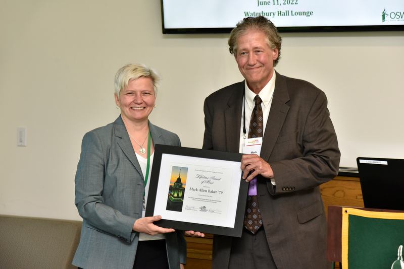 Mark Allen Baker ’79, an award-winning non-fiction author and biographer, earned the Lifetime Award of Merit during Reunion. Oswego Alumni Association Award winners were honored during the College Update presented by Mary Toale (pictured), SUNY Oswego officer in charge, in Waterbury Hall. 