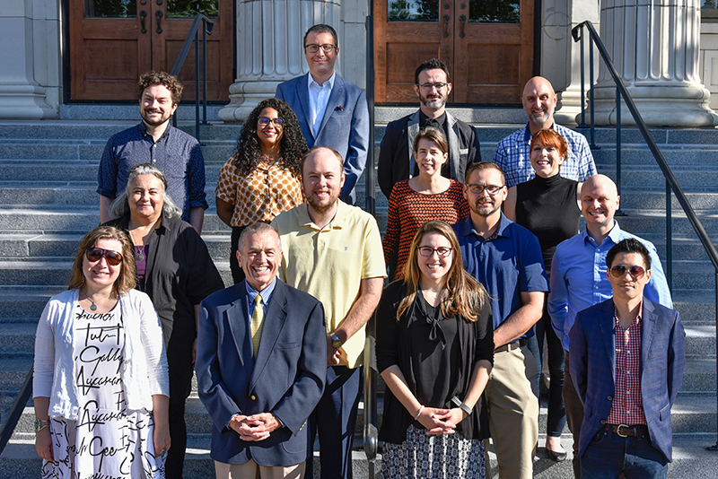 New faculty on the steps of Sheldon Hall at New Faculty and Professional Staff Orientation, August 15-16 at SUNY Oswego.