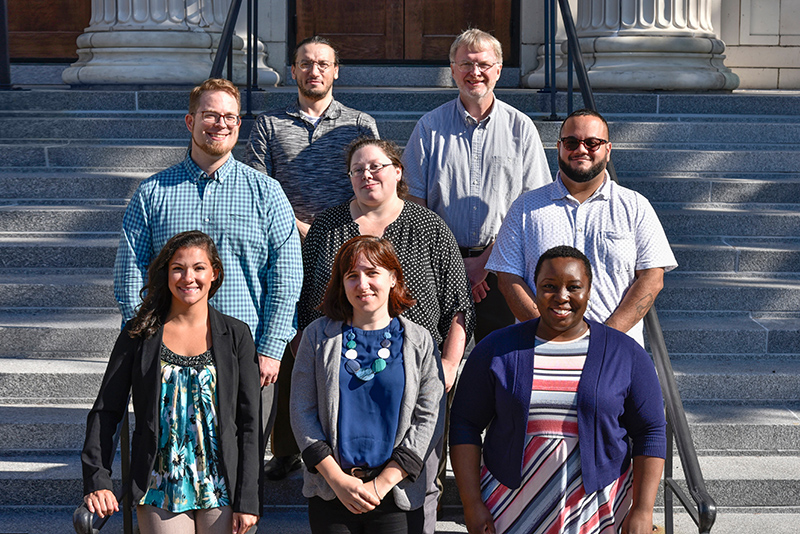 New visiting assistant professors on the steps of Sheldon Hall 