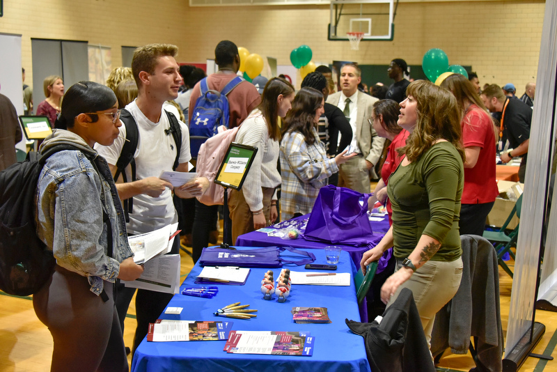 The Fall 2022 Career and Internship Fair held Oct. 12 in Swetman Gym saw very high attendance by students to meet with local, regional and national business employers and talk about career possibilities and current opportunities. At left, Machilia Johnson, a marketing major, and Noah Culligan, a communications and business administration dual major, talk with Claire Nichols, a talent acquisition specialist with Sherwin-Williams.