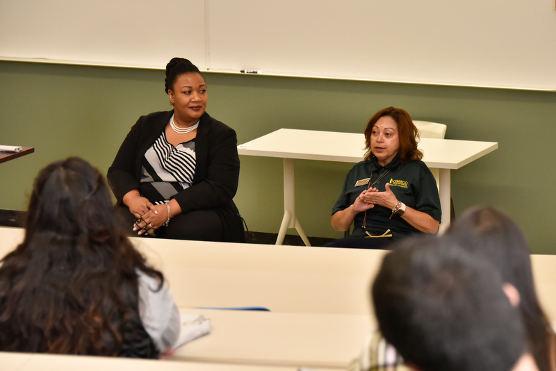 Alumnae Katrina Allen-White, left, principal with the Syracuse City School District; and Maggie Rivera, assistant dean of students for student outreach and support at SUNY Oswego, lead a panel discussion during the Educational Opportunity Program presentations on Oct. 14 in Lanigan Hall.