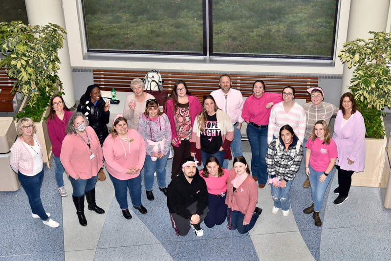 Pink Day participants gather for the group photo Oct. 20 in Marano Campus Center. The event organized by the SUNY Oswego State Employees Federated Appeal (SEFA) chapter aims to promote Breast Cancer Awareness Month, while donations made from these events through SEFA will benefit Oswego County Opportunities Cancer Services.