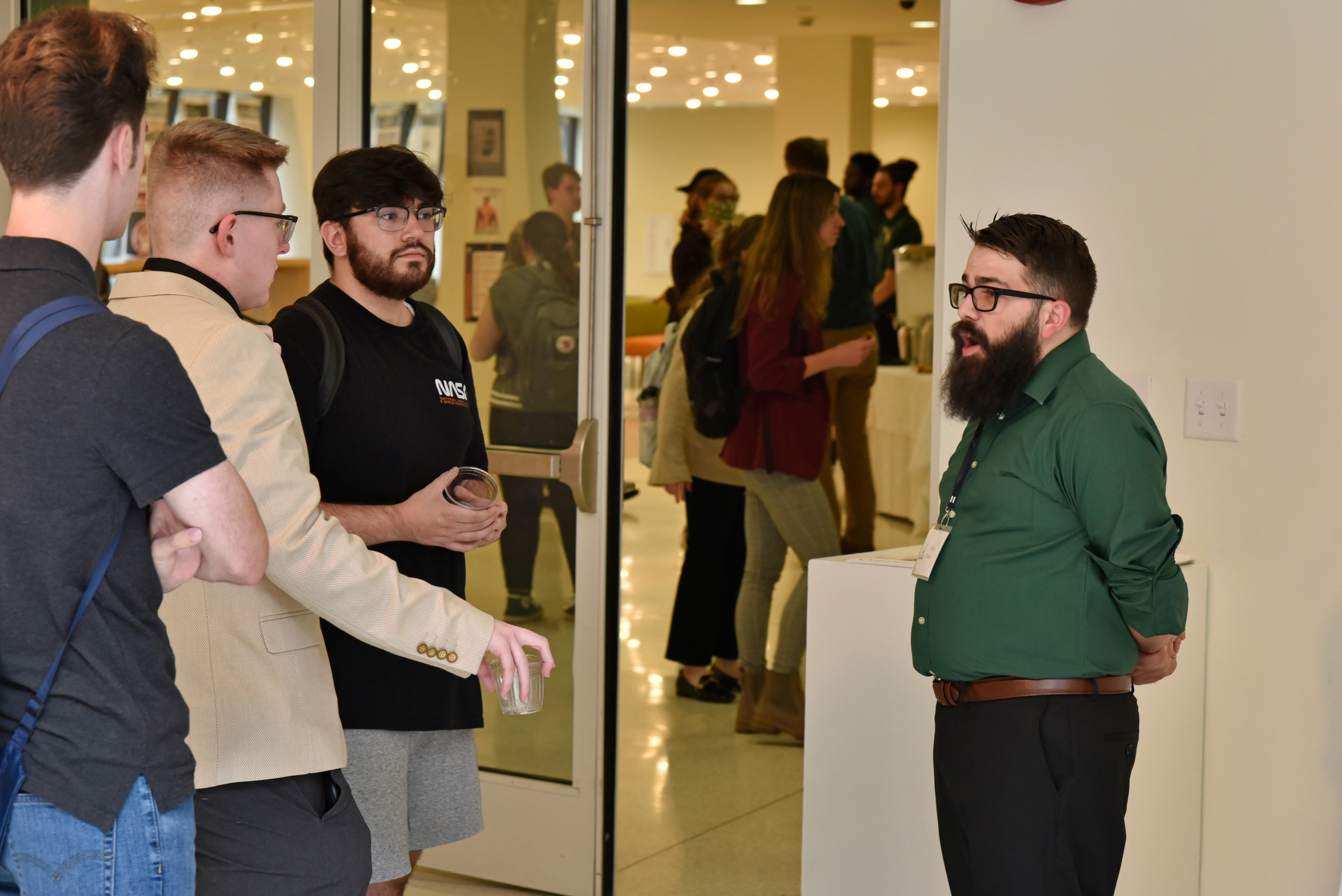 Students attending the Media Summit had the opportunity to talk with alumni professionals during the Career Connectors event held in Tyler Art Gallery after the panel discussion. Pictured talking with a group of current students is Paul Andrew Esden Jr (at right), a 2015 broadcasting and mass communication graduate now co-host of "The Manchild Show with Boy Green" on The Score 1260 in Syracuse. 