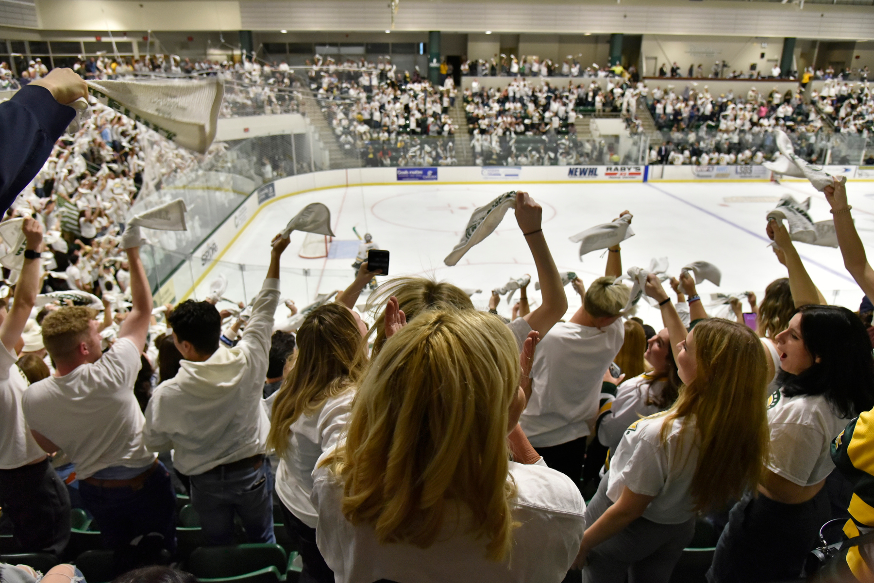Oswego fans celebrate Nov. 4 during the Lakers men's hockey contest with the archrival Plattsburgh Cardinals during White Out weekend. The Lakers skated away with a 5-1 win.