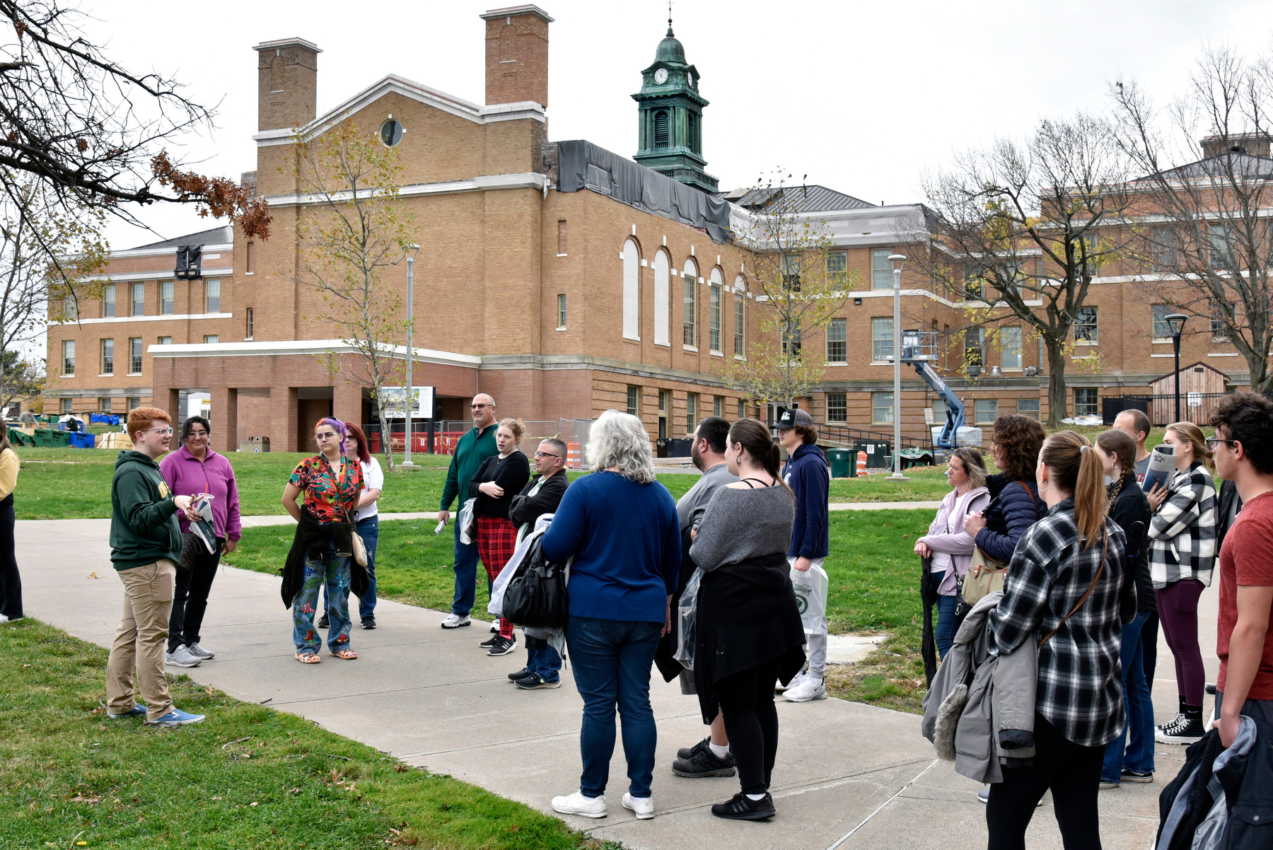 Admissions student tour guide Scott Brubaker (left) leads a visiting group outside Sheldon Hall during the campus open house held Nov. 11 on Veterans Day.