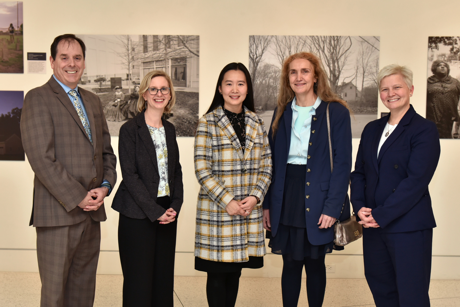 Several faculty members were recently promoted to the rank of full professor. Marking the occasion during a Feb. 16 ceremony in Tyler Hall, Provost Scott Furlong (left) and SUNY Oswego Officer in Charge Mary C. Toale (right) gather with promoted faculty, from left: Rebecca Mushtare, art and design as well as associate dean of graduate studies; Jing Lei, anthropology; and Isabelle Bichindaritz, computer science.