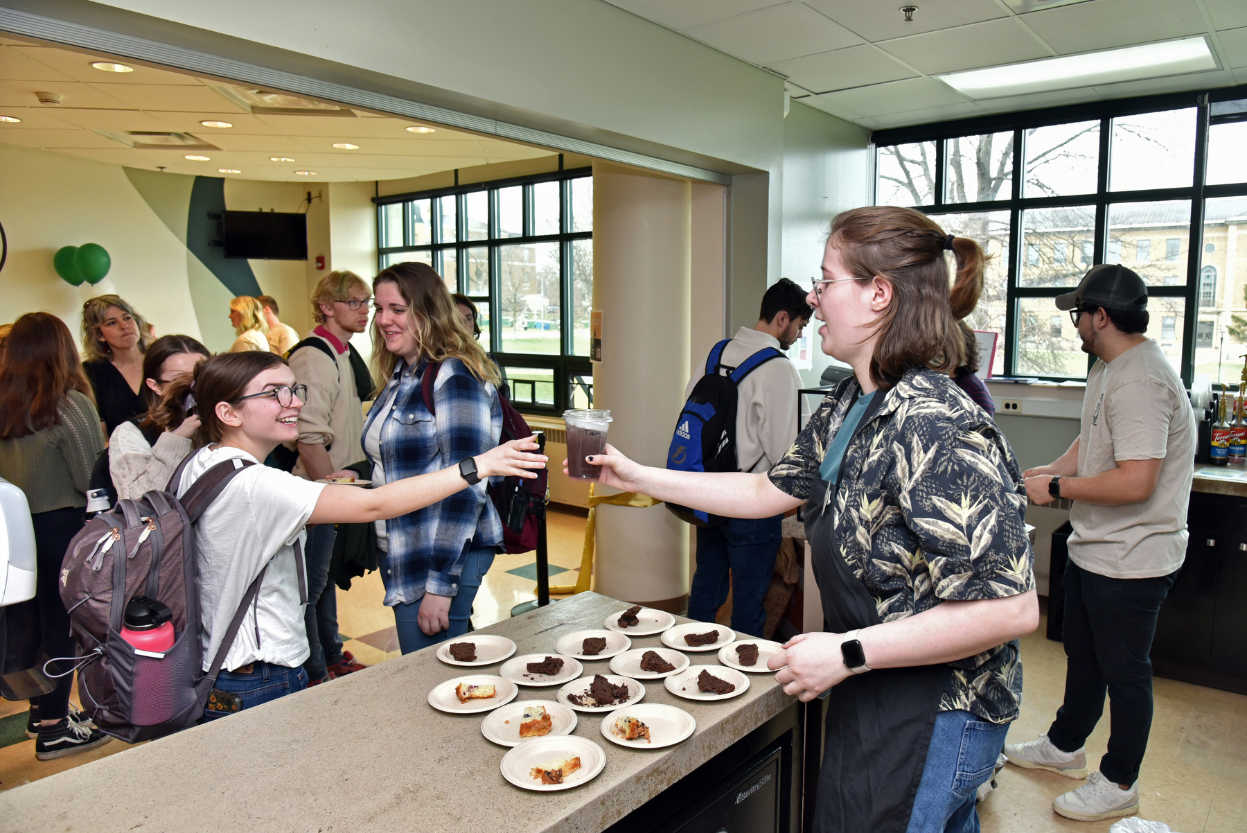 The Rich N' Pour Cafe, a new student-led, student-run cafe located in Rich Hall, opened this semester to the campus and community after hard work by students in a SUNY Oswego business class. Students in the Management 444 course along with college staff and administrators celebrated its grand opening and ceremonial ribbon cutting on Tuesday, April 11.