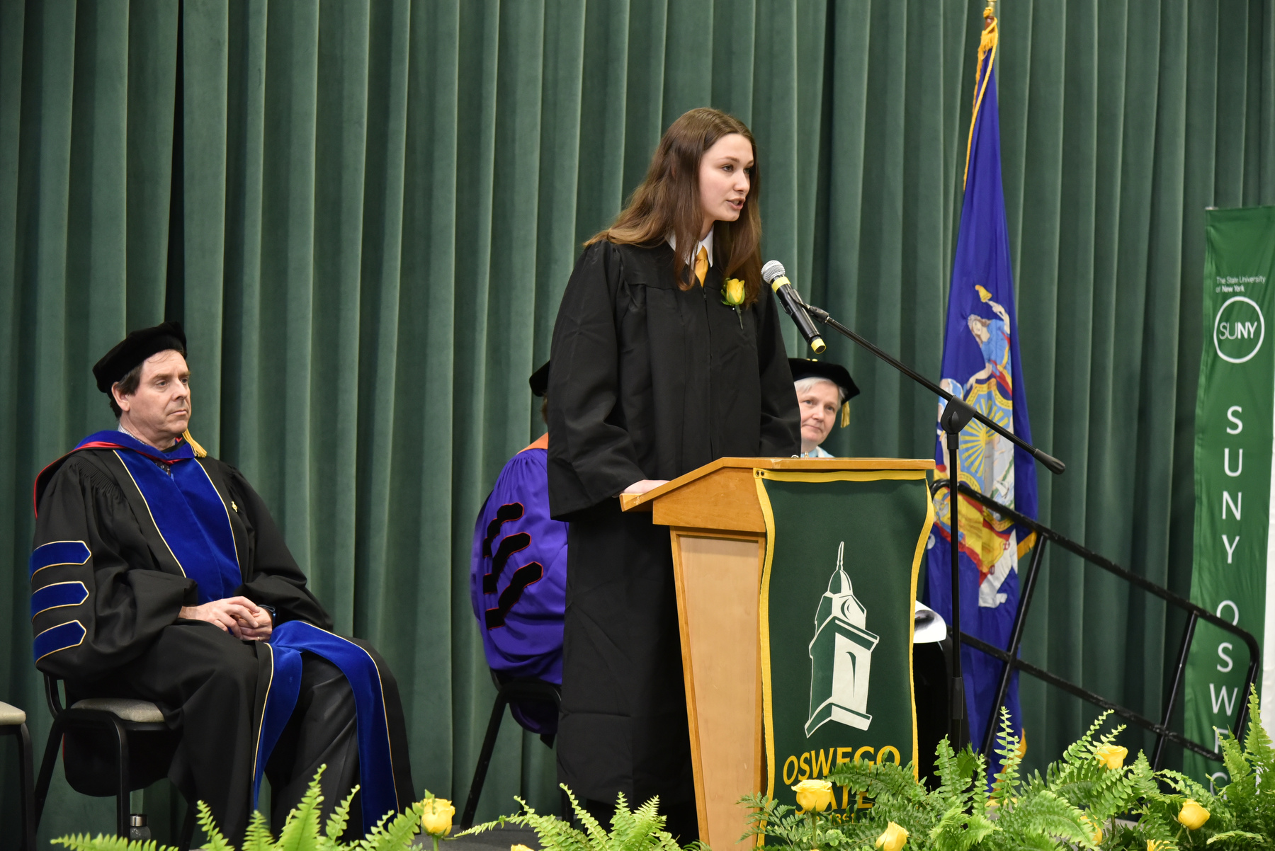Vega President Kylie Annable offers opening remarks at Honors Convocation held April 21 in the Deborah F. Stanley Convocation Hall and Arena, Marano Campus Center. 