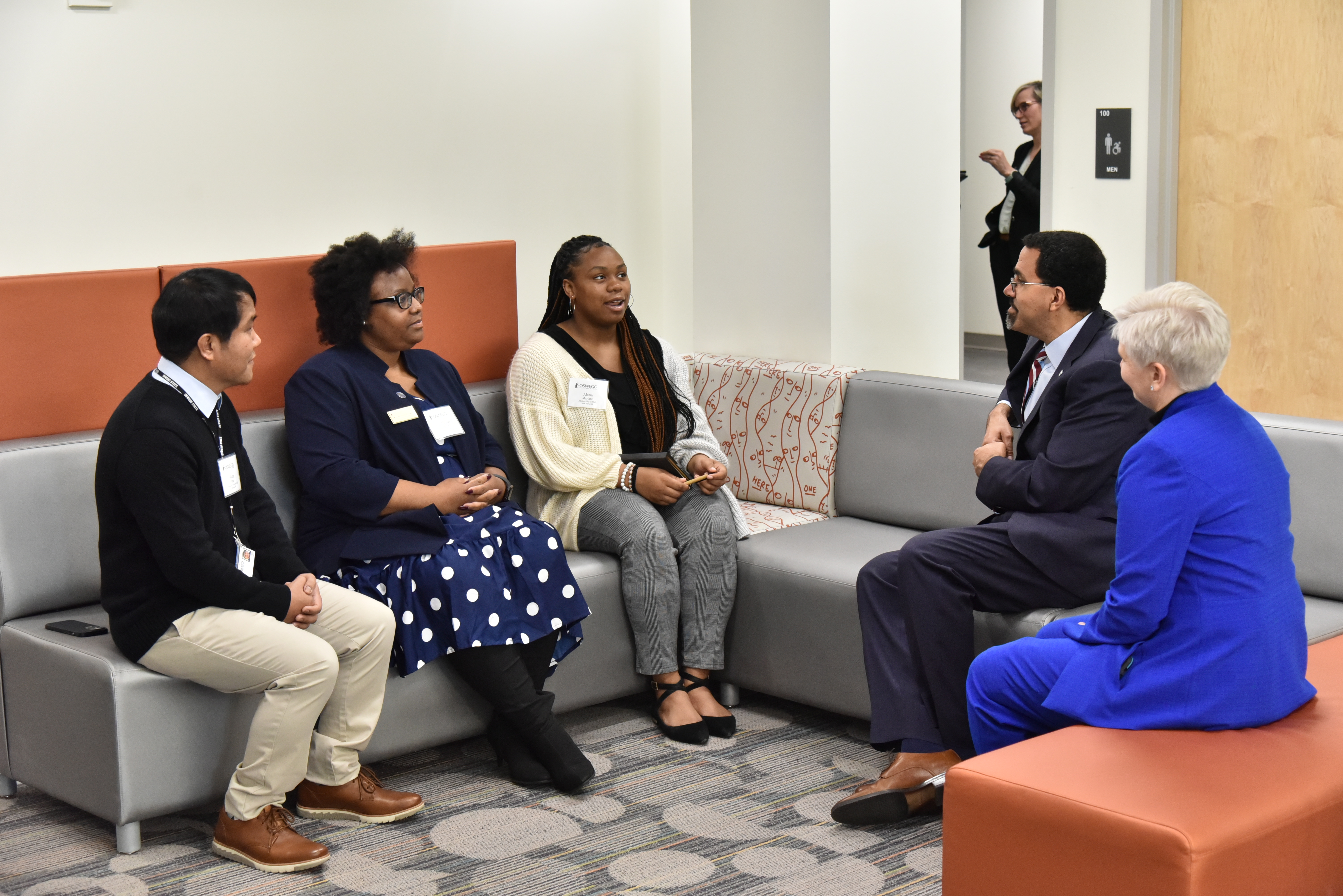 Chancellor John B. King Jr. listens to student teachers talk about what they do