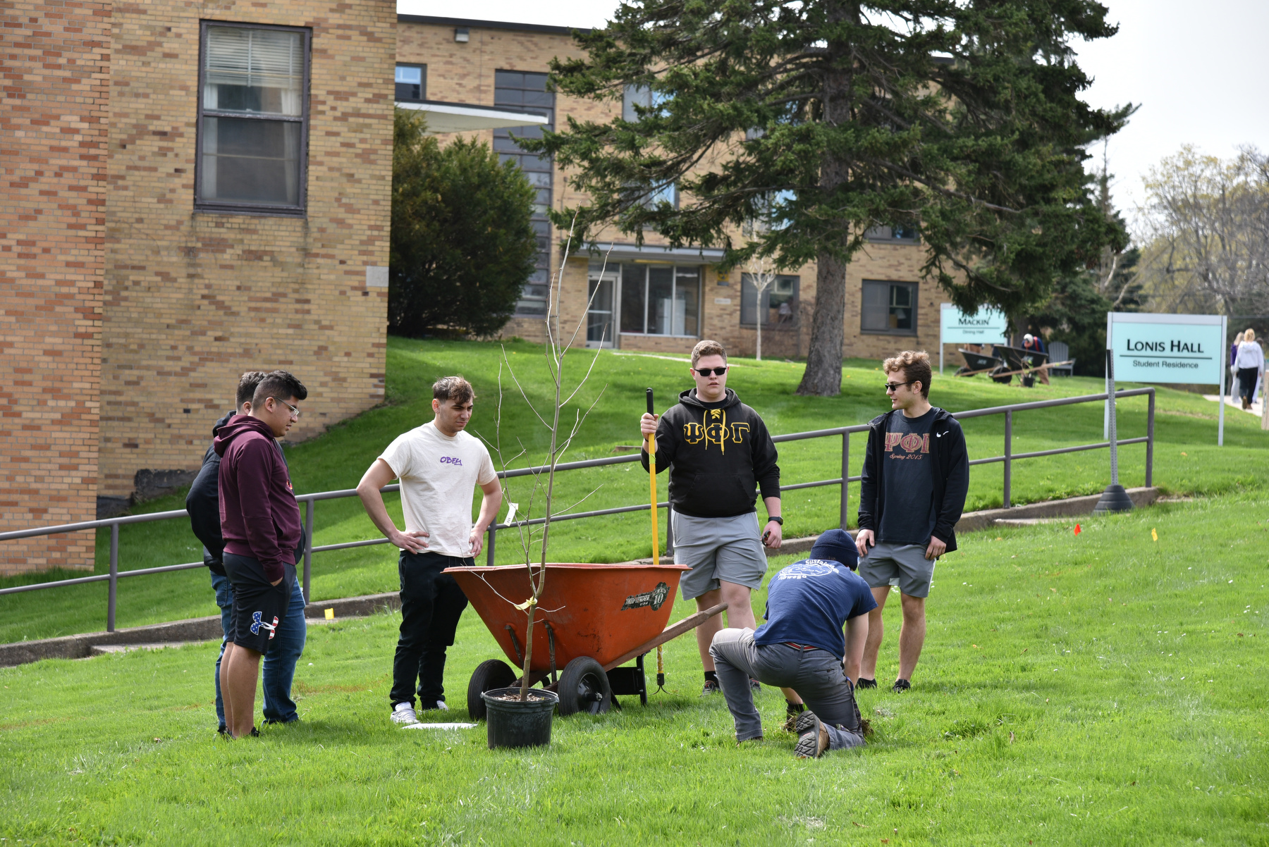 Campus and community members honored Arbor Day on April 28 with some tree plantings on campus and observance readings and speakers at Rice Creek Field Station.