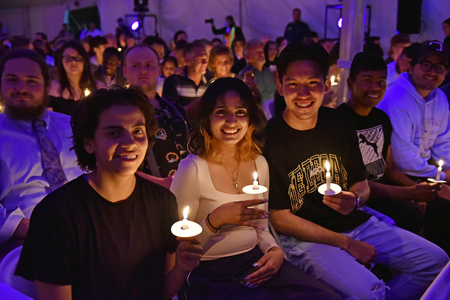Graduating seniors, families and guests show their joy during the Torchlight Ceremony. 