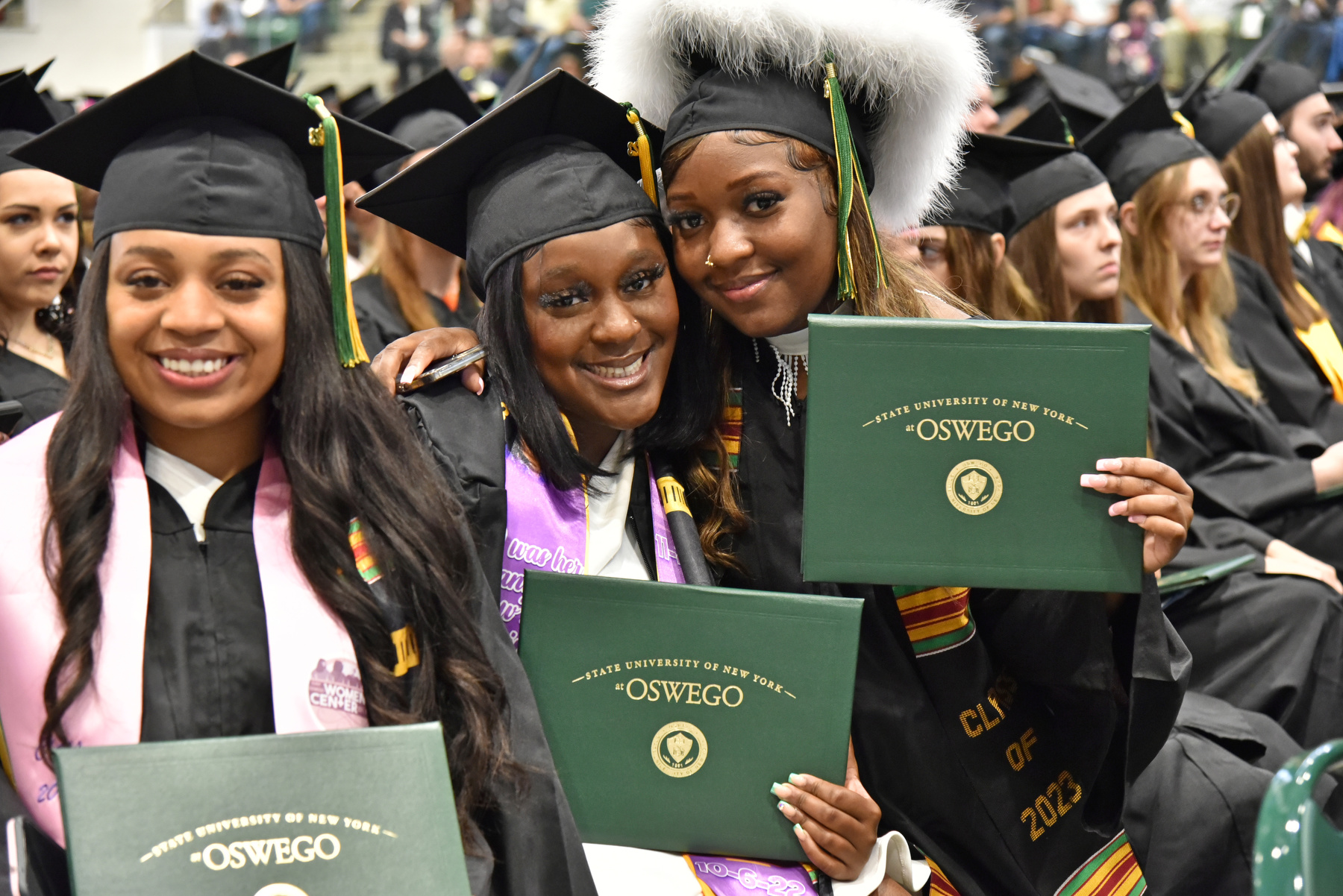 Graduates show their pride during the 9 a.m. College of Liberal Arts and Sciences Commencement ceremony.