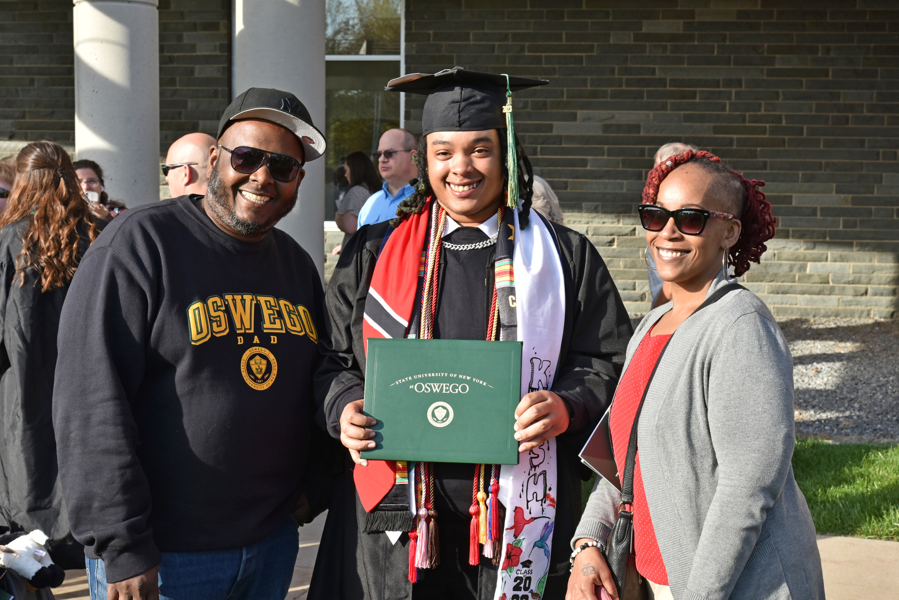 Happy graduates like broadcasting major Kashaun Blackman gathered with loved ones after the 4 p.m. School of Communication, Media and the Arts and the School of Education Commencement ceremony.