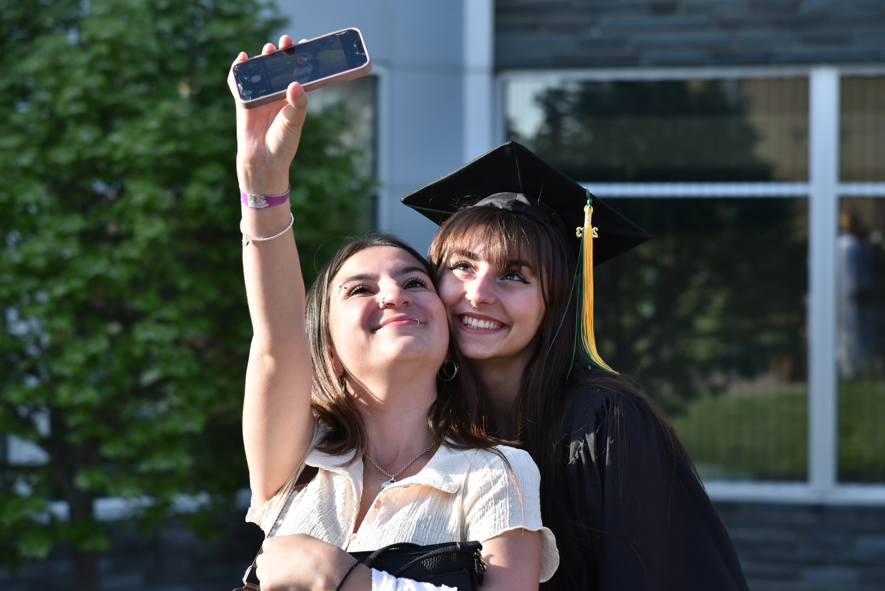Graduates gathered with their families and friends for celebrations and photos after the 4 p.m. School of Communication, Media and the Arts and the School of Education Commencement ceremony.