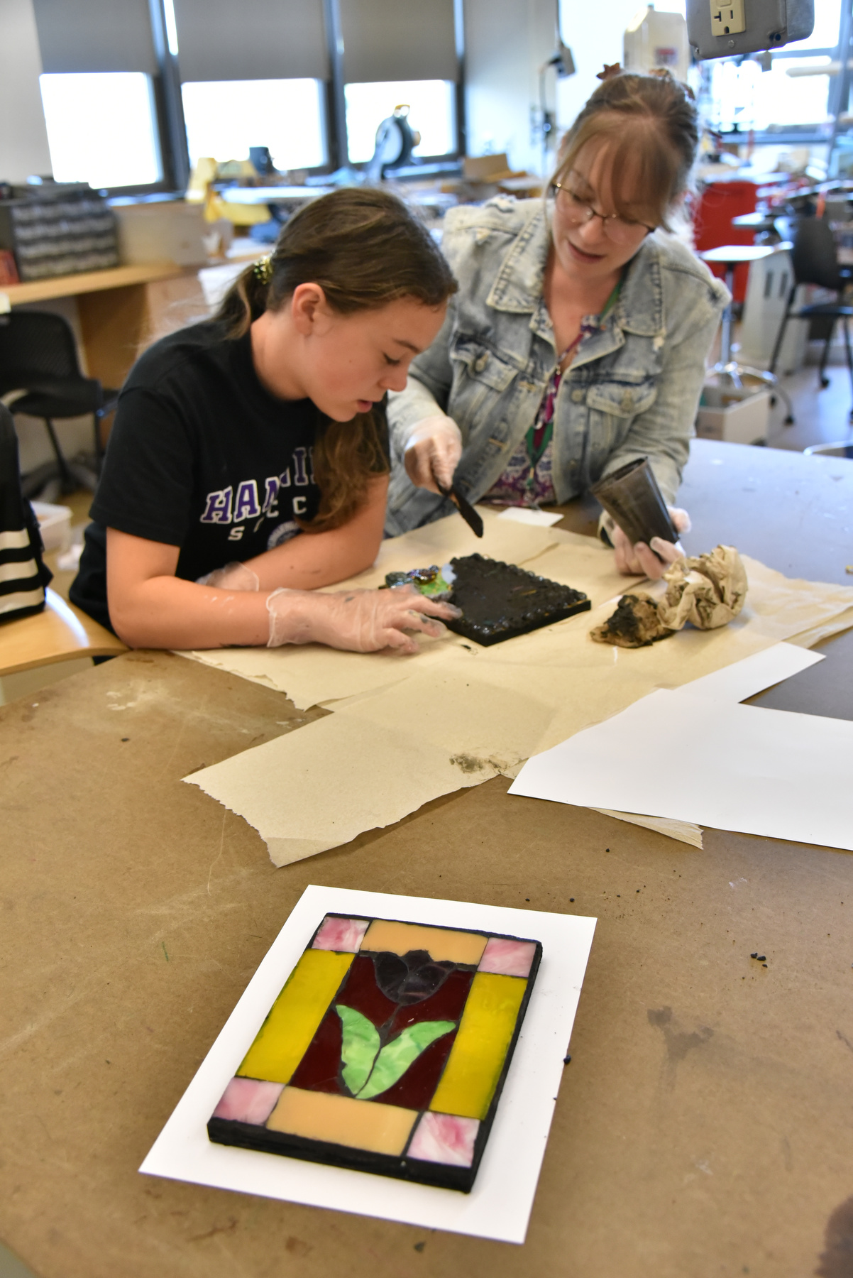 The 44th annual Sheldon Institute for Barbara Shineman Scholars program, which ran this summer from July 24 to Aug. 4, provided children entering grades two through ten wonderful opportunities to explore their interests and develop their skills in fun and creative ways in class sessions led by professional educators. Lauren Boyer (right) teaches art painting, stained glass collage and air dry clay sessions in Park Hall.