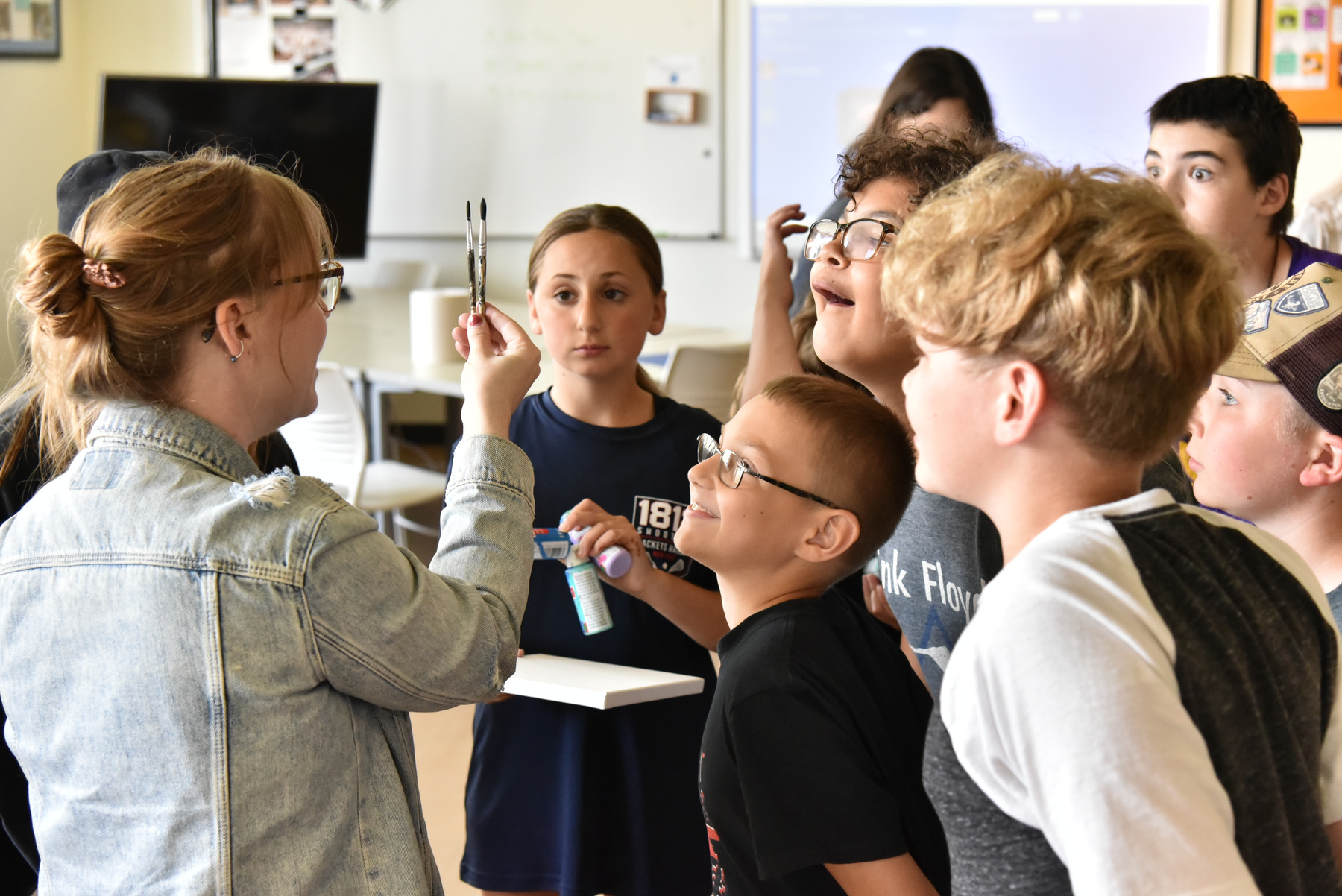 Lauren Boyer (left) teaches art painting in Park Hall during the Sheldon Institute for Barbara Shineman Scholars program. 