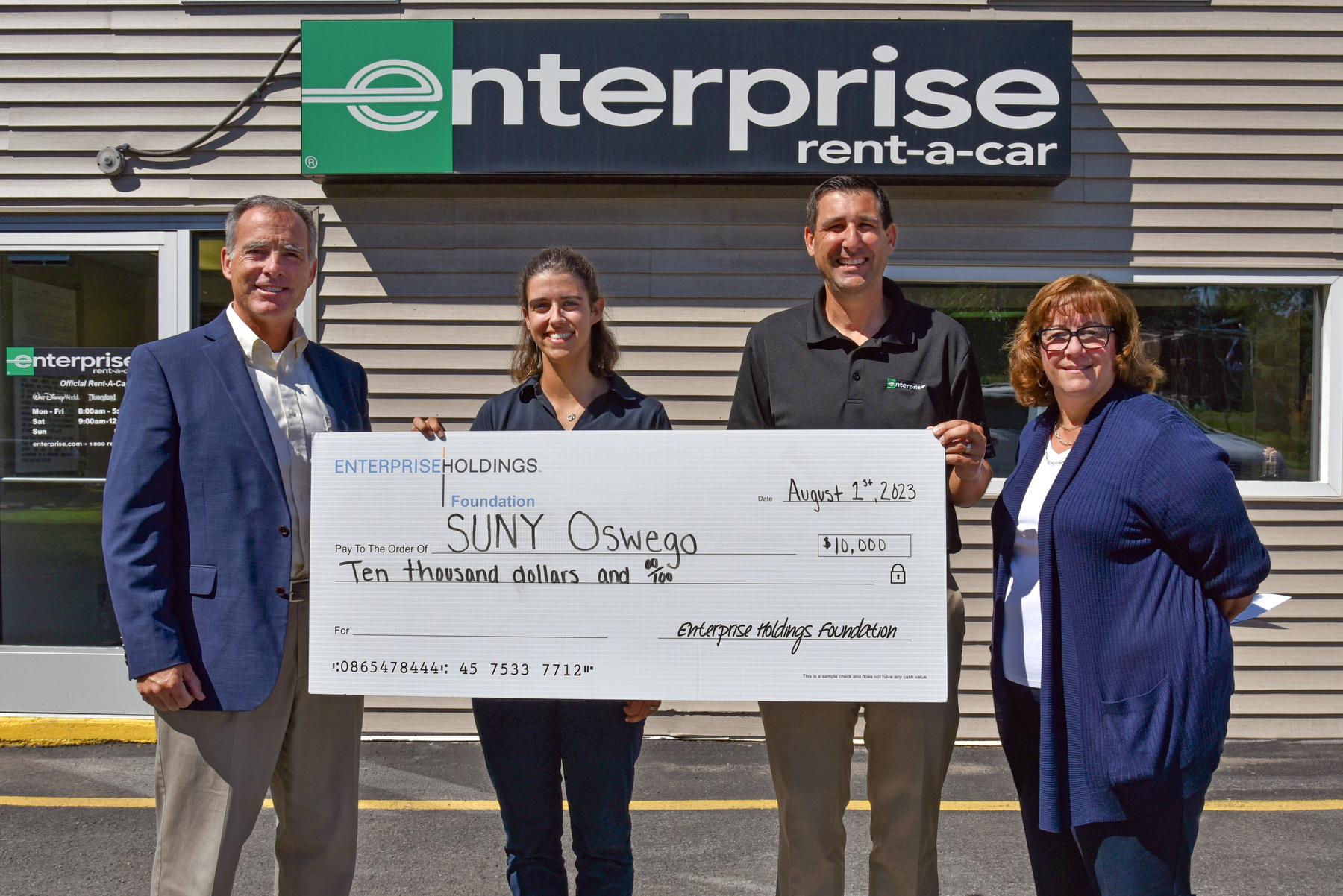 Enterprise Holdings Foundation presented a gift of $10,000 to SUNY Oswego Career Services. Zoe Arnell (second from left), Oswego branch manager of Enterprise Holdings, and Jody Giarrusso (third from left), talent acquisition manager of Enterprise Human Resources, present the check to Gary Morris (left), from the Office of Career Services, and Jennifer Hill, executive director of career services, corporate and foundation relations at SUNY Oswego.