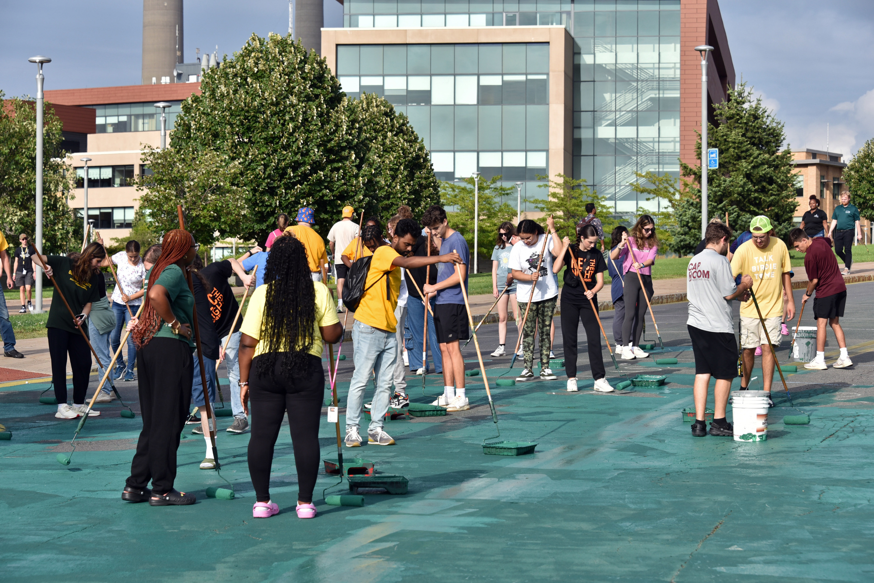 The Paint the Road Green event invites students, faculty and staff to join together to paint the Marano Campus Center bus loop green to show our campus spirit. This fun event, in its second year, is part of Laker Launch. 