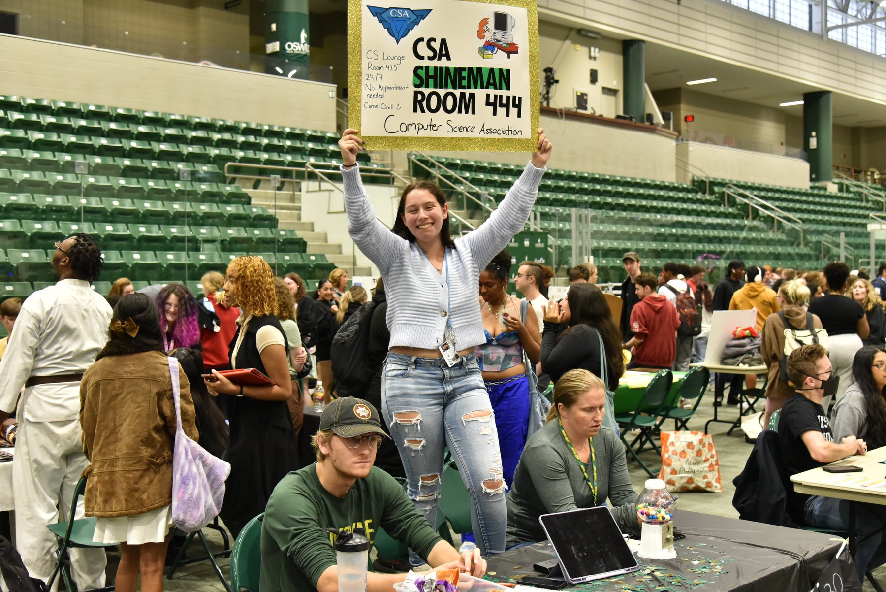 The Computer Science Association communicates their meeting location -- Room 444 in the Shineman Center -- during the fall Student Involvement Fair.