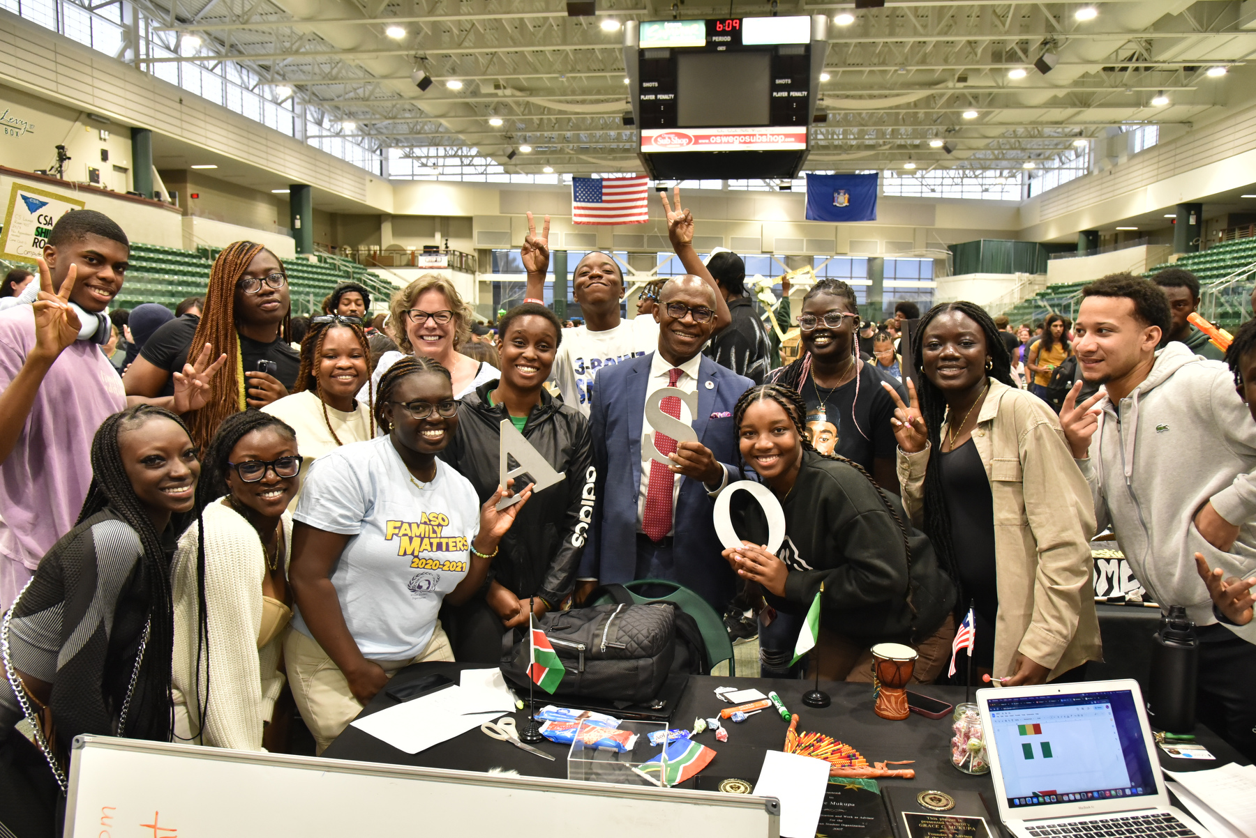 resident Peter O. Nwosu and Kathleen Kerr, Vice President for Student Affairs, gather with members of African Student Organization and other students Aug. 30 for a photo while visiting the fair.