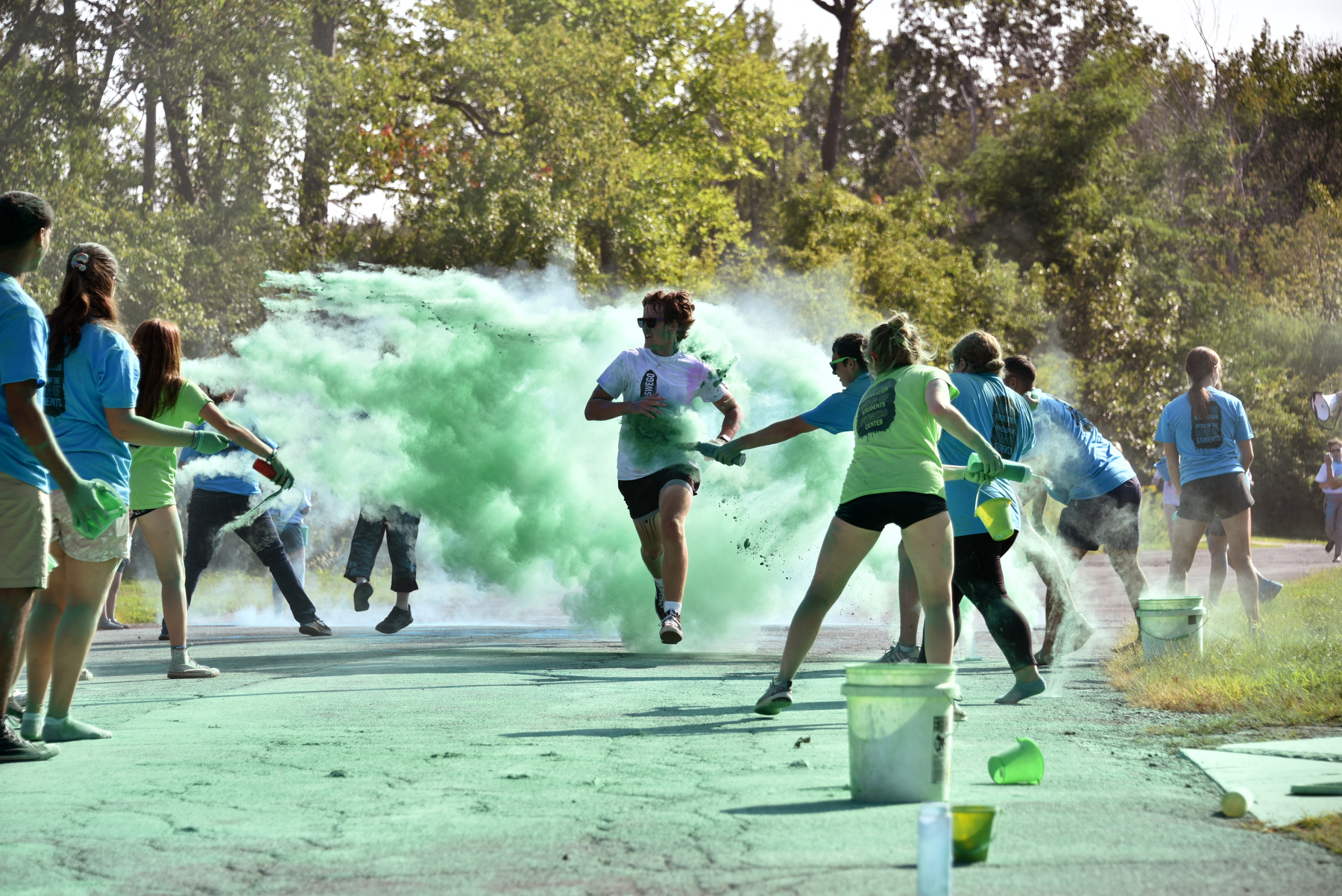 The annual Color Run is a 1.5-mile fun-filled run/walk around SUNY Oswego's Glimmerglass Lagoon, co-sponsored by the Dean of Students Office/Oz Peer Eds program and the Fitness Center. Participants end up covered with color while running through brightly hued powder.