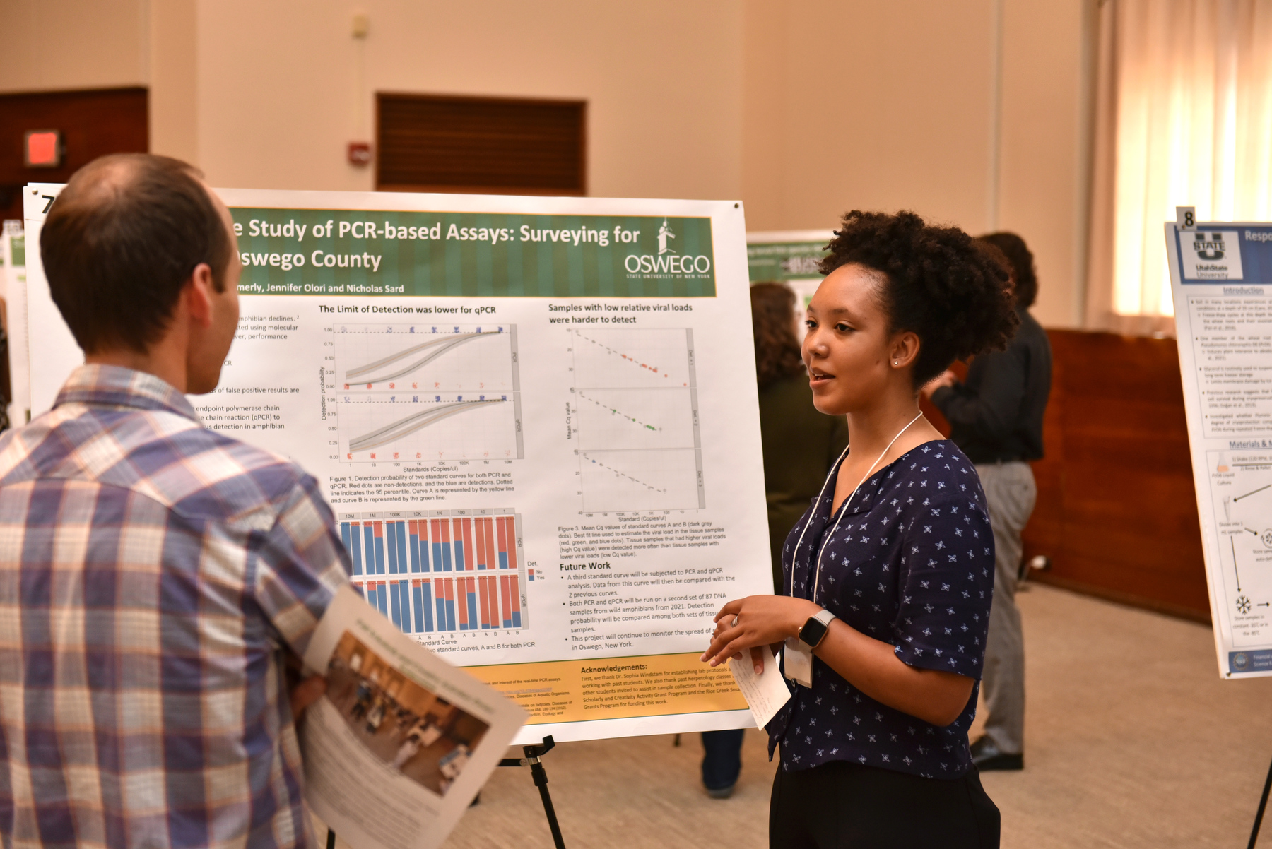 The Fall 2023 Scholarly and Creative Activities Poster Symposium held Sept. 8 in Sheldon Hall ballroom showcased a range of student research subjects. Najiyah Williamson (pictured) talks with biological sciences faculty member Peter Newell about her research, conducted with Susan Hammerly, Jennifer Olori and Nicholas Sard, titled “A Comparative Study of PCR-based Assays: Surveying for Ranavirus In Oswego County.”