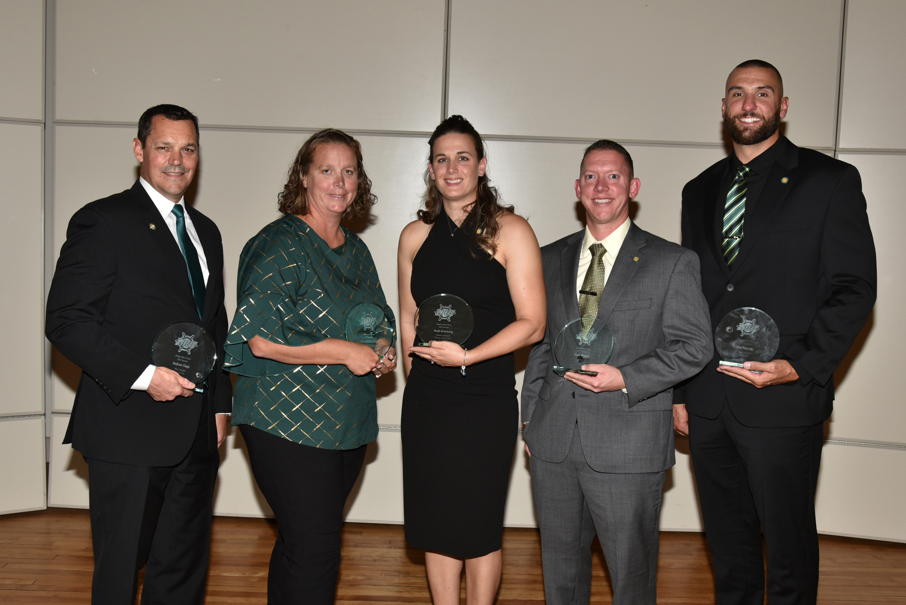 Six Laker alumni officially joined the Oswego State Athletic Hall of Fame at an induction ceremony and dinner Sept. 23 in the Sheldon Hall ballroom. The latest honorees include, from left, are Andrew Clapp ’96, baseball; Robyn Bramoff Mott ’04, basketball and field hockey; Heidi Armstrong ’08, women’s volleyball and track and field; Kevin Morgan ’08, swimming and diving; and Chad Burridge ’12, basketball. Not pictured is inductee Jon Whitelaw ’13 M’18, men’s hockey, who was unable to attend. 